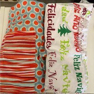 2 Aprons: Feliz navidad pattern. Red and blue dot/ stripes.